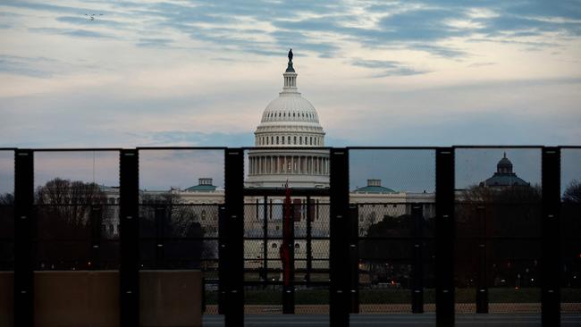 The US Capitol building in Washington is seen through security fencing, ahead of President-elect Donald Trump’s inauguration. Picture: AFP