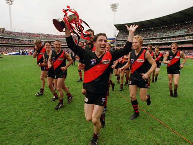 SEPTEMBER 25, 1999 : Bombers players celebrate victory after Essendon v St Kilda Reserves AFL grand final at Melbourne Cricket Ground (MCG), 25/09/99. Pic Darren Tindale.Australian Rules