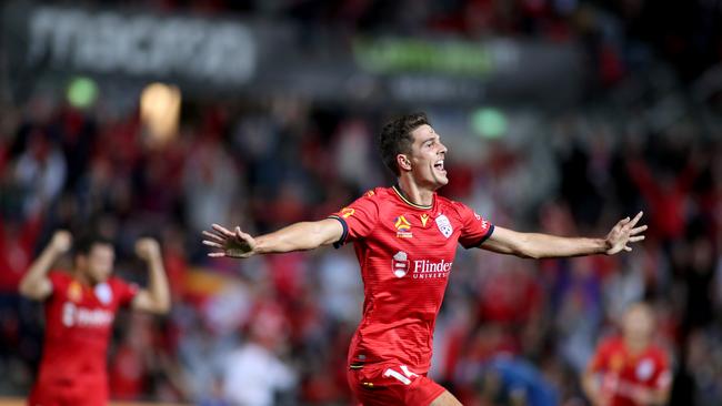 Adelaide United’s George Blackwood celebrates his stunning goal in a 2-0 win over Central Coast Mariners at Coopers Stadium. (AAP Image/Kelly Barnes)