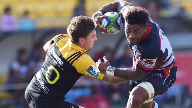 Amanaki Fafi of the Rebels, right, runs past Beauden Barrett of the Hurricanes during the Round 2 Super Rugby match between the Hurricanes and the Melbourne Rebels at Westpac Stadium in Wellington, New Zealand, Saturday, March 4, 2017. (AAP Image/SNPA, Ross Setford) NO ARCHIVING, EDITORIAL USE ONLY