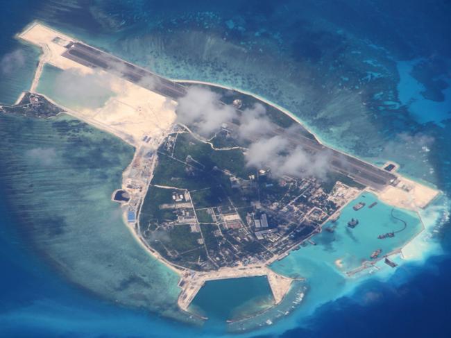 SANSHA, CHINA - JUNE 19:  (CHINA OUT) (Image taken through window on plane) Aerial view of the Yongxing Island also known as Woody Island of Xisha Islands in the South China Sea on June 19, 2014 in Sansha, Hainan Province of China.  (Photo by VCG/VCG via Getty Images)