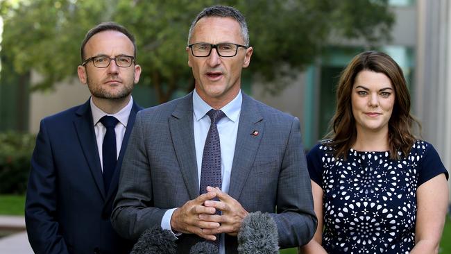 Climate change treated ‘like a joke’ ... Greens leader Richard Di Natale, centre, with Adam Bandt and Sarah Hanson-Young. Picture: Kym Smith.