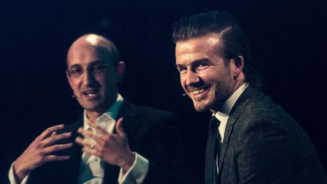 Syed (pictured with soccer player David Beckham) believes sporting lessons can be applied to business.