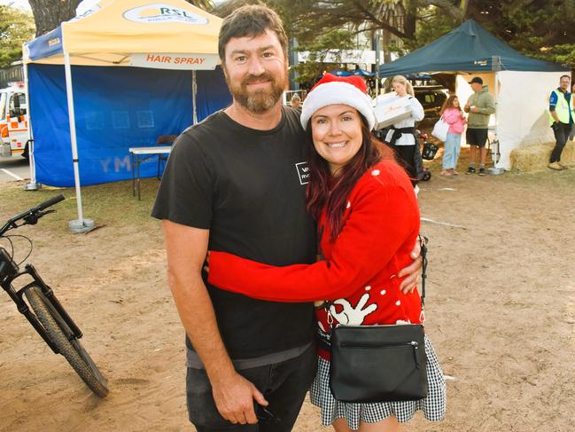 Kane Muir and Jenna Hiscock getting festive at the Phillip Island Christmas Carols by the Bay at the Cowes Foreshore on Tuesday, December 10, 2024. Picture: Jack Colantuono