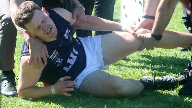 Katandra’s Ryleigh Shannon dislocated his knee running onto ground before the start of the grand final. Picture Yuri Kouzmin