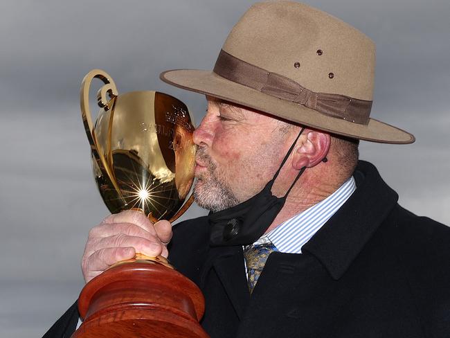 Peter Moody and a kiss for the Caulfield Cup trophy. Picture: Michael Klein