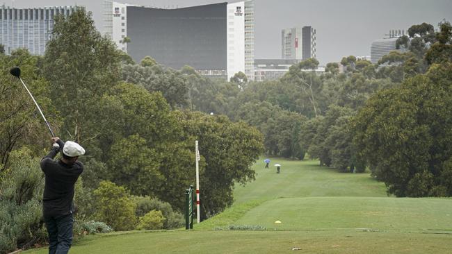 Golfers at the North Adelaide golf course. The club and others around the state have been recommended to close because of the coronavirus pandemic. Picture: AAP/Mike Burton