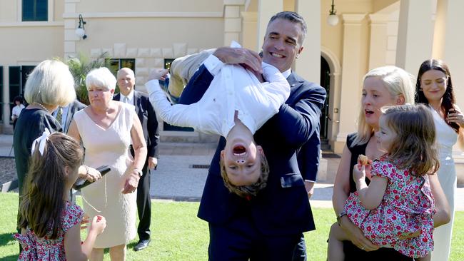 Peter Malinauskas plays with son Jack after his swearing-in by Governor Frances Adamson on Monday. Picture: Kelly Barnes