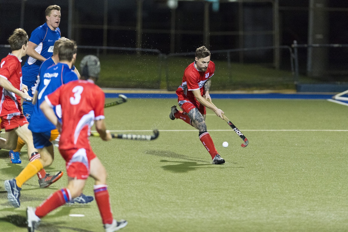 Bradley Hobday (right) gets to the ball for Red Lion against Newtown in Toowoomba Hockey COVID Cup men round four at Clyde Park, Friday, July 31, 2020. Picture: Kevin Farmer