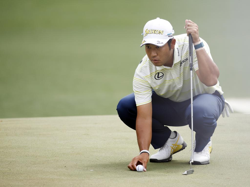 Hideki Matsuyama looks over a putt on the sixth green. (Photo by Jared C. Tilton/Getty Images)