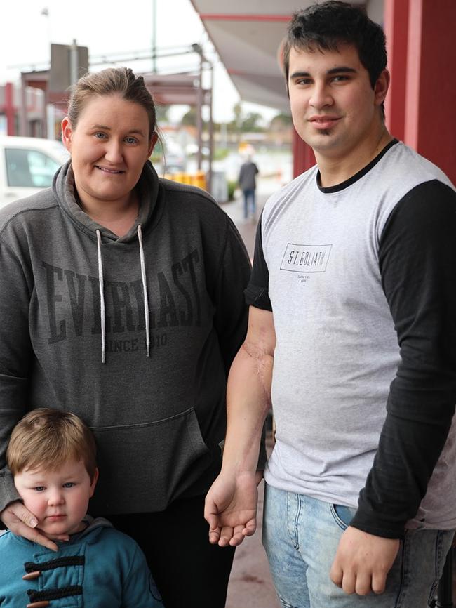 Corey (right), pictured with his family, lost the use of his right arm in a workplace incident. Picture: Supplied