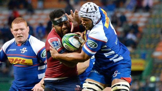 TOPSHOT — Reds centre Samu Kerevi fights off Stormers forward Nizaam Carr (R) during the Super Rugby clash match between Stormers and Reds at the Newlands Stadium on March 24, 2018, in Cape Town. / AFP PHOTO / ANDER GILLENEA