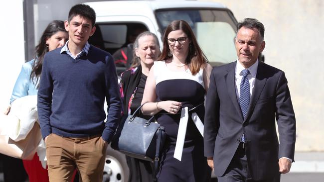 Victorian Liberal party member for Hawthorn John Pesutto (right) and staff arriving at Parliament House in Melbourne. Picture: AAP/David Crosling