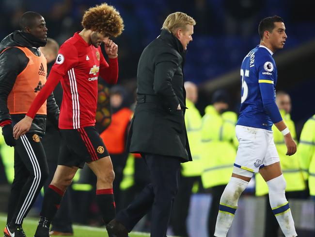 Marouane Fellaini of Manchester United (2L) looks dejected