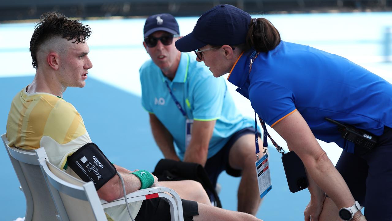 Draper gets checked out by medical staff. (Photo by Julian Finney/Getty Images)