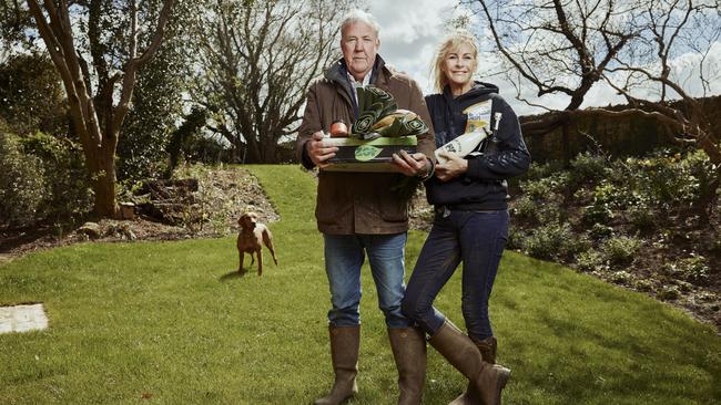 Jeremy Clarkson and Lisa Hogan holding produce from the Diddly Squat Farm Shop. Picture: The Sunday Times