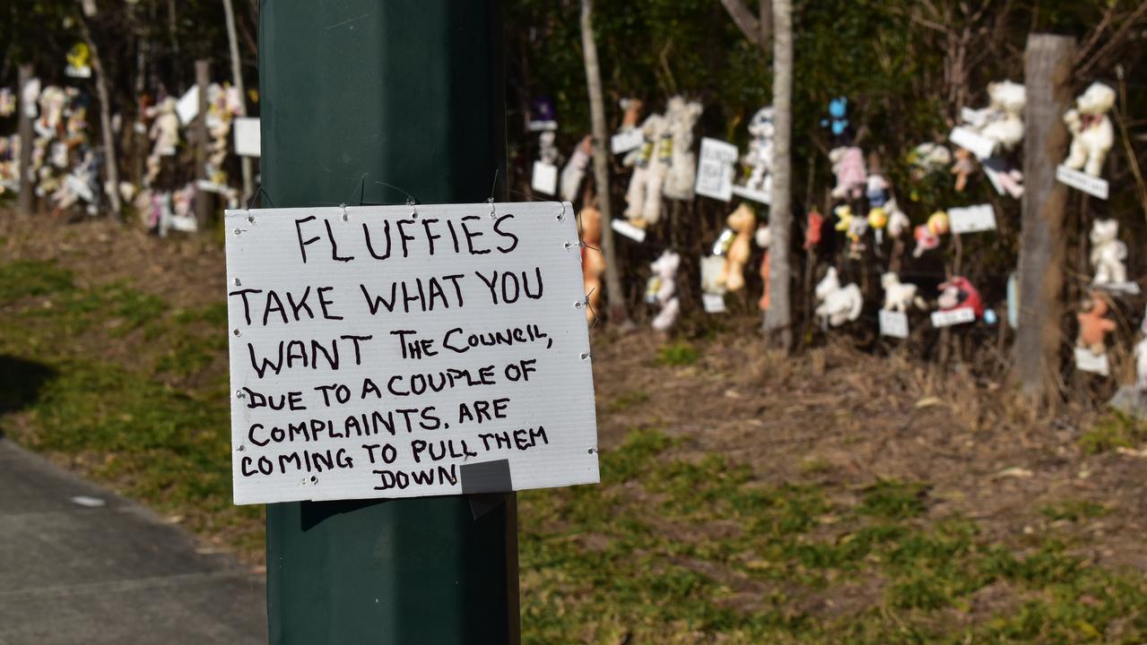 Ipswich residents have been invited to visit the fence this week, for the last time, and take home any stuffed toys they like. Picture: Jessica Baker