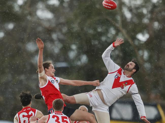 Karingal ruckman Duncan Proud goes up against Red Hill’s Zach Vines.