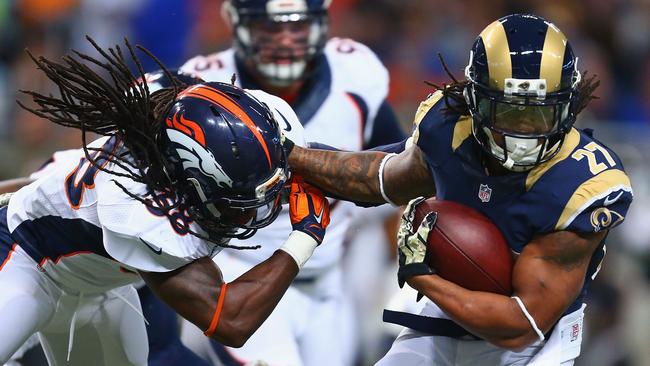 Tre Mason #27 of the St. Louis Rams slips a tackle attempt.