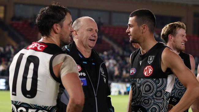 Ryan Burton (right) was subbed out of the match. Picture: Sarah Reed/AFL Photos via Getty Images