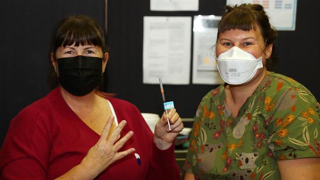 Kimbra Power receives her fourth Covid vaccination from registered nurse immuniser Tam Casey at Barwon Health Belmont. Picture: Alison Wynd