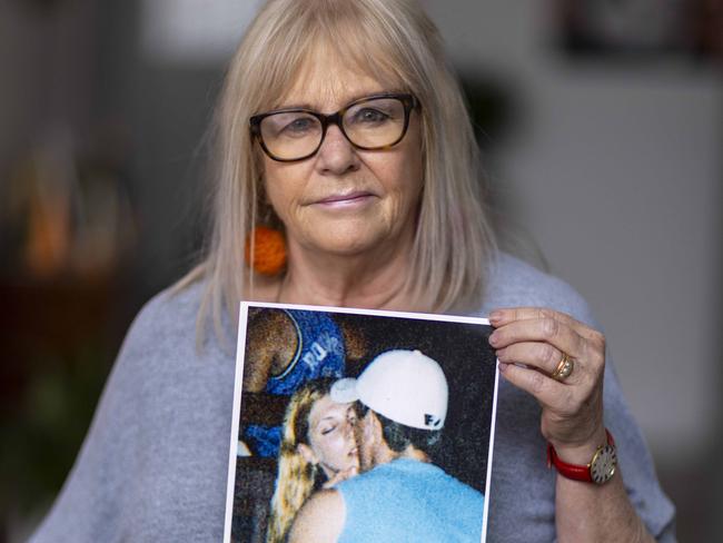 October 7 2022: Angela Vaskin - mother of Bali Bombing victim Josh Deegan holding a photo of Josh and his girlfriend at her home in Fullarton. Picture: Kelly Barnes