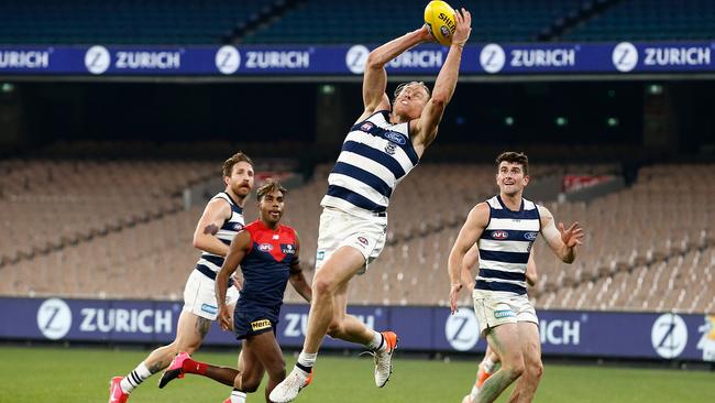 Geelong’s Mark Blicavs pulls in a mark against Melbourne at the MCG on Sunday. Picture: Getty Images