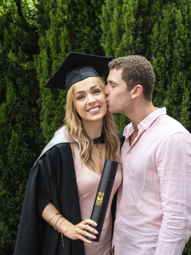 Bachelor of Business graduate Madeleine Scott is congratulated by John Stevens at the UniSQ graduation ceremony at Empire Theatres, Tuesday, December 13, 2022. Picture: Kevin Farmer