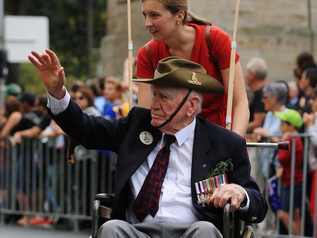 Bill Whyte is pushed in his wheelchair by grand daughter Georgia. Picture: Toby Zerna