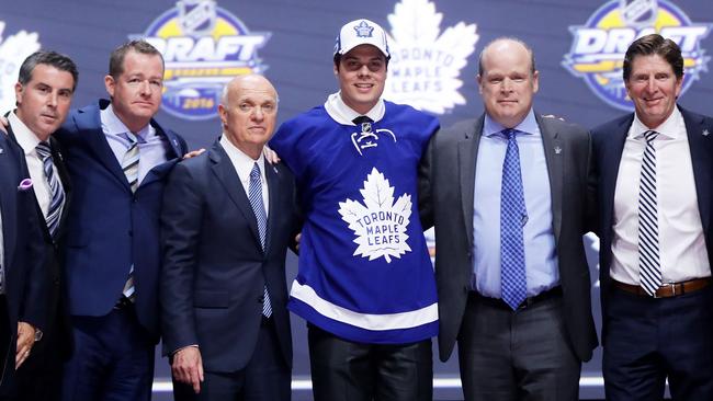 Auston Matthews celebrates onstage with the Toronto Maple Leafs after being selected first overall during round one of the 2016 NHL Draft.