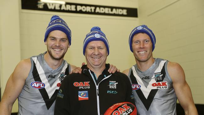 Port Adelaide's Jack Watts with Ken Hinkley and Brad Ebert and their MND charity beanies. Picture SARAH REED