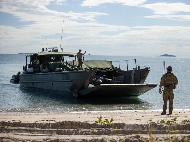 An Australian Army soldier guides a LCM-8 onto Townshend Island as a part of Exercise Sea Raider..