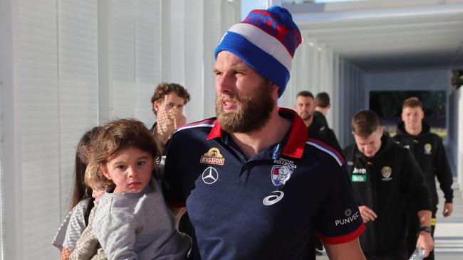 AFL players from Richmond and the Western Bulldogs arrive at the Gold Coast Airport with their families before heading to their hotels. Picture Glenn Hampson