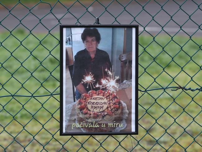 A picture of a St Basil's resident on the fence outside the Fawkner facility. Picture: NCA NewsWire/David Crosling