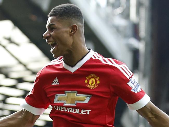 Manchester United's Marcus Rashford, celebrates after he sores the opening goal of the game during the English Premier League soccer match between Manchester United and Arsenal at Old Trafford Stadium, Manchester, England, Sunday, Feb. 28, 2016. (AP Photo/Jon Super)