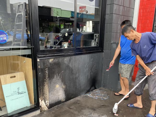 Smashed glass and burns to the exterior of Saigon Hustle restaurant. Picture: Kirsten Jelinek