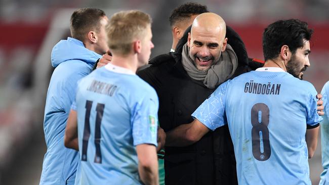 Pep Guardiola celebrates with his players after winning the first leg of the English League Cup against rivals Manchester United Picture: AFP