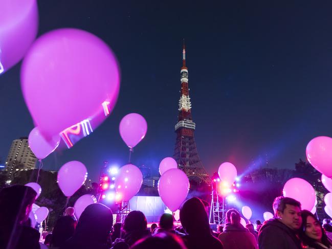 People hold balloons during the count down event at the Prince Park Tower Tokyo hotel on December 31, 2018 in Tokyo. Picture: Getty