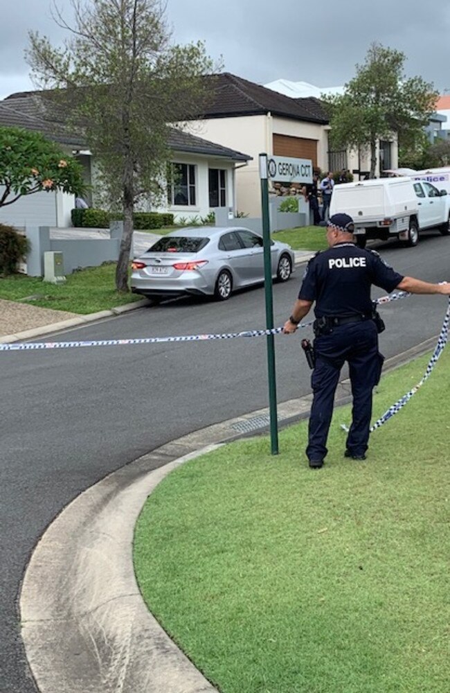 Authorities on scene at a Varsity Lakes residence after a woman's body was found. A man has also been rushed to hospital. Picture: Greg Stolz