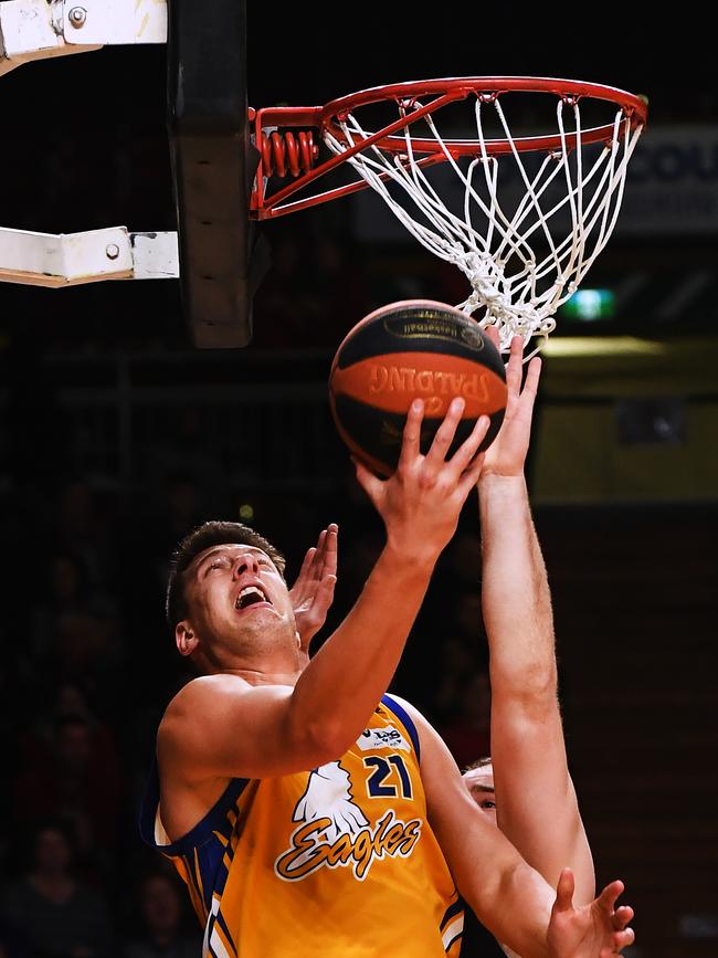 Forestville and Adelaide 36ers big man Daniel Johnson goes for a lay-up under pressure during Saturday night’s grand final. Picture: AAP/Mark Brake.