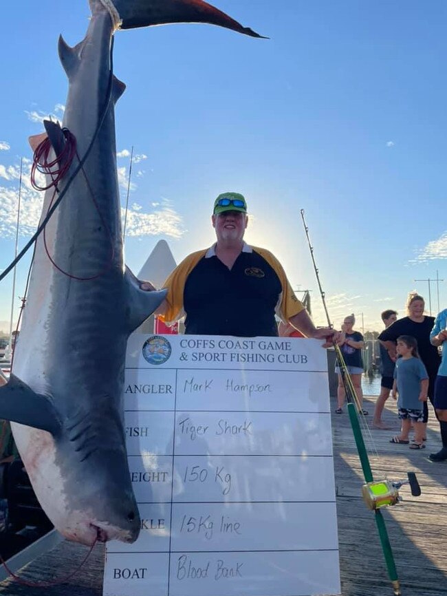 A photo from the competition showing a large 150kg tiger shark hauled in.