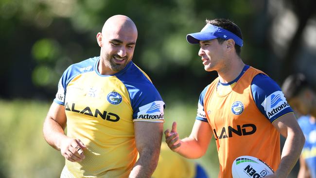 Parramatta Eels players Tim Mannah (left) and Mitchell Moses take part in a team training session at the Old Saleyards Reserve, in Sydney, Monday, April 1, 2019. (AAP Image/Joel Carrett) NO ARCHIVING