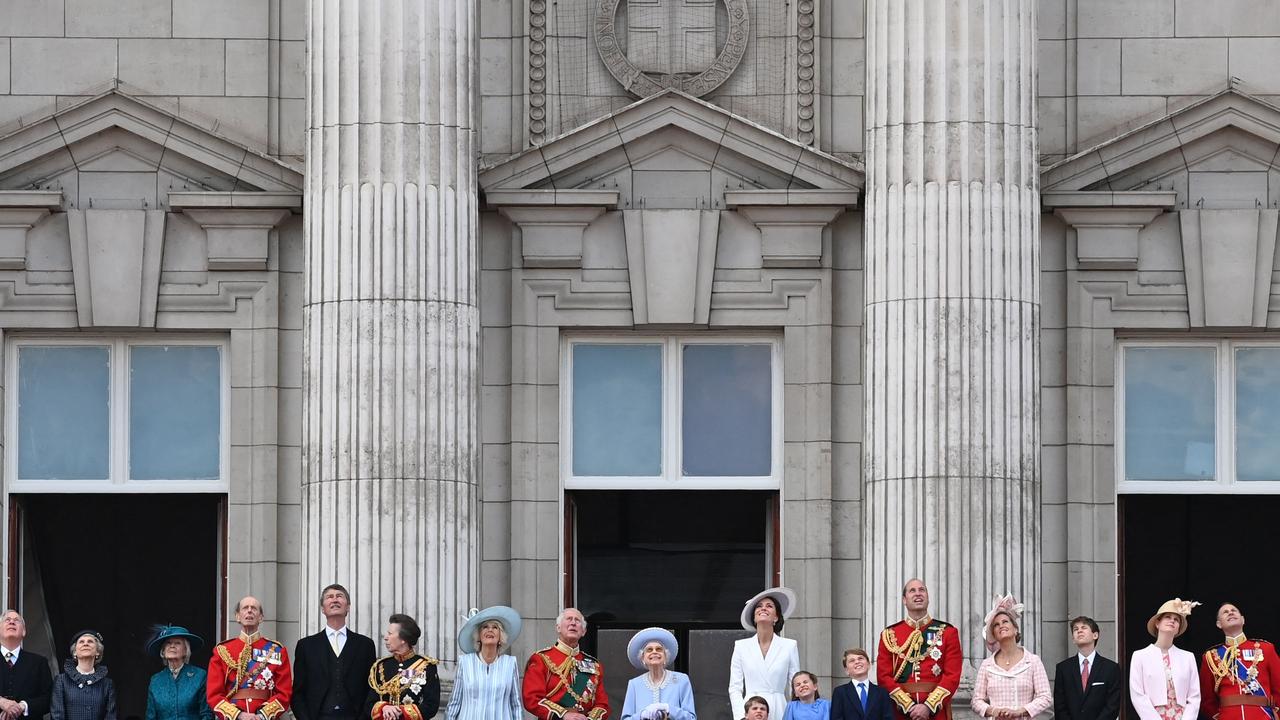 Britain's Queen Elizabeth II stands with members of the Royal family to watch a special fly-past from Buckingham Palace balcony following the Queen's Birthday Parade, the Trooping the Colour, as part of Queen Elizabeth II's platinum jubilee celebrations. (Photo by Daniel LEAL / AFP)