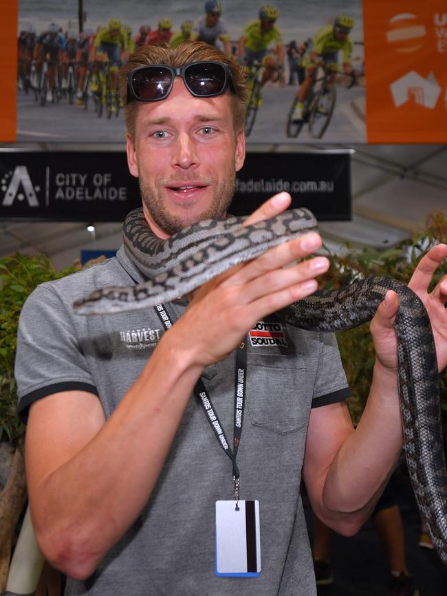 Lotto-Soudal rider Roger Kluge of Germany with a snake at the Adelaide Tour Village. Picture: Tim de Waele/Getty Images