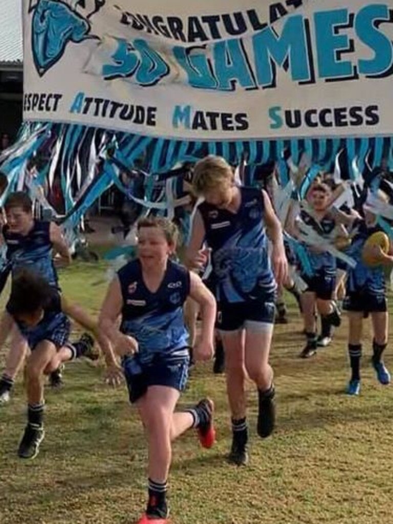 SA Little Legend Mitchell Bennett, 12, runs out with his U12 Glenunga Rams Football Club teammates to celebrate the lads’ 50-game milestone. Eleven of the proud young players shared in the 50-game milestone, most having started with the ‘great, really inclusive club’ as U8s. Seeing the teammates run through the banner together was described as ‘really special to watch’. Good luck with the rest of the season, Rams. Picture: Supplied