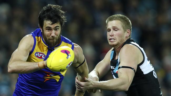 Young Power defender Tom Clurey puts heat on gun West Coast Eagles forward Josh Kennedy. Picture: Sarah Reed