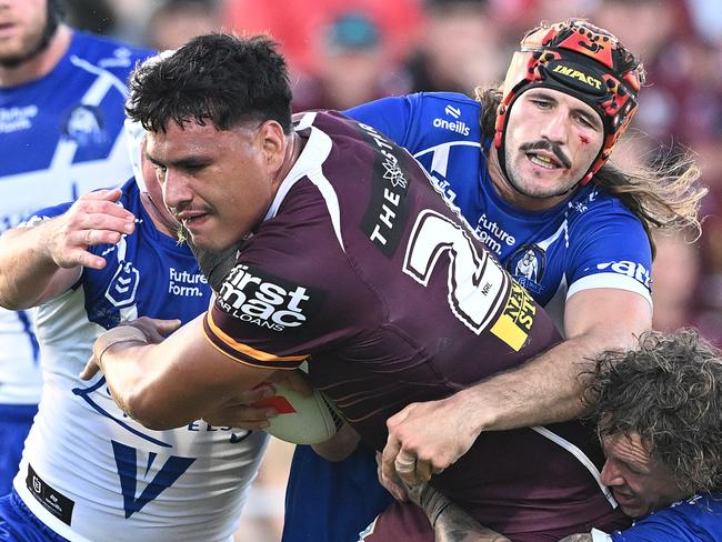 BRISBANE, AUSTRALIA - FEBRUARY 22: Benjamin Te Kura of the Broncos takes on the defence during the 2025 NRL Pre-Season Challenge match between Brisbane Broncos and Canterbury Bulldogs at Kayo Stadium on February 22, 2025 in Brisbane, Australia. (Photo by Bradley Kanaris/Getty Images)