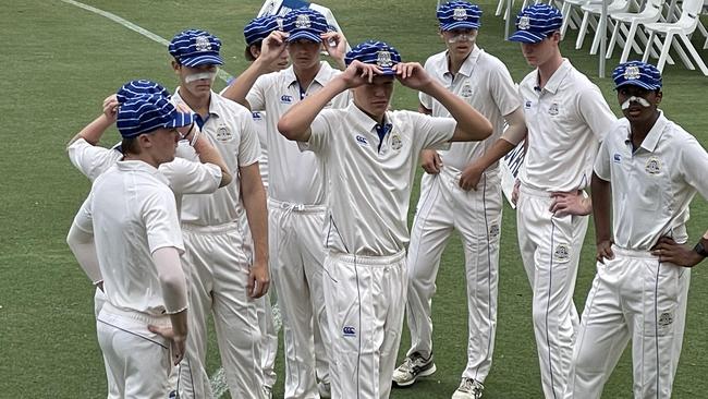 Nudgee's Ed Kasprowicz, middle, with his teammates today.