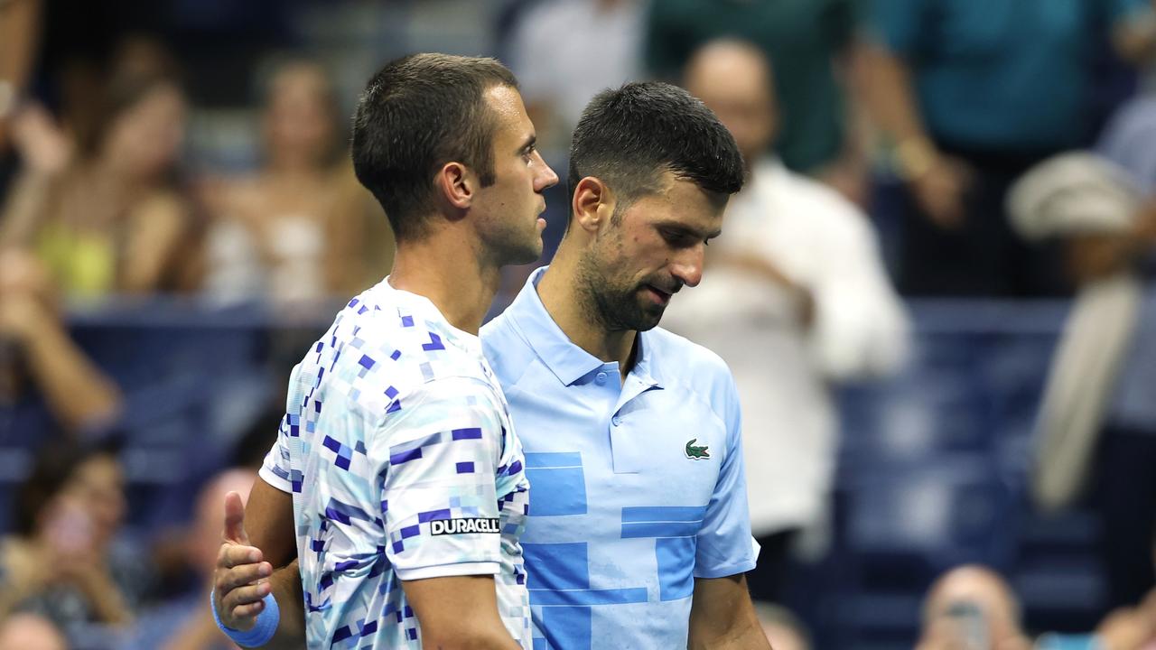 NEW YORK, NEW YORK - AUGUST 28: Laslo Djere of Serbia retires in the third set after an injury against Novak Djokovic of Serbia.