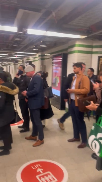Commuters queue to get on train platforms